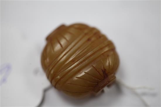 A Chinese yellow chalcedony bead, 19th century, 2.6cm